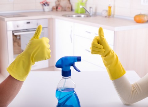 Cleaning professionals servicing a modern office reception in EC2
