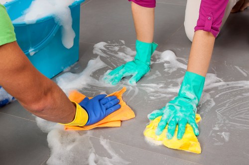 Professional cleaners preparing a flat for end of tenancy cleaning in EC2