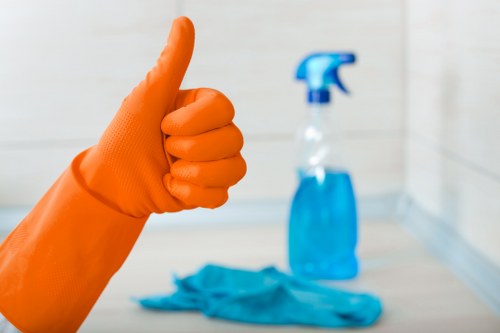 Local cleaner carrying out routine cleaning in an EC2 office space